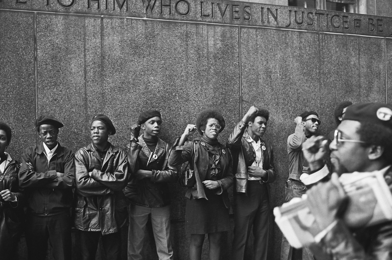 View of a line of Black Panther Party members as they demonstrate, fists raised outside the New York City courthouse, New York, New York, April 11, 1969. (Photo by David Fenton/Getty Images)